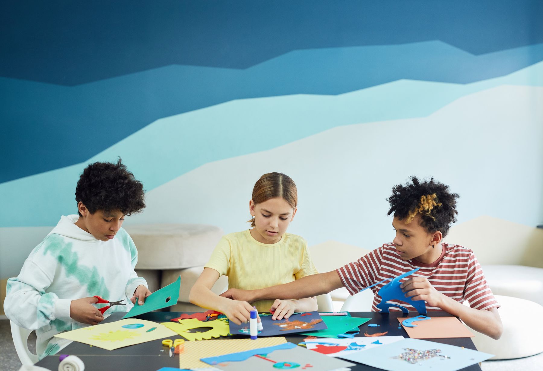 Children taking part in a colourful hands-on craft activity
